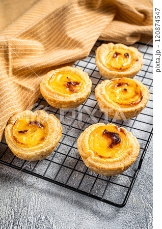 Traditional Portuguese pastry - pastel de nata fresh baked. White background. Top view 120874547