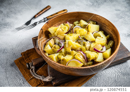Bowl of warm potato salad with bacon, German Kartoffelsalat. White background. Top view Bowl of warm potato salad with bacon, German Kartoffelsalat. White background. Top view 120874551