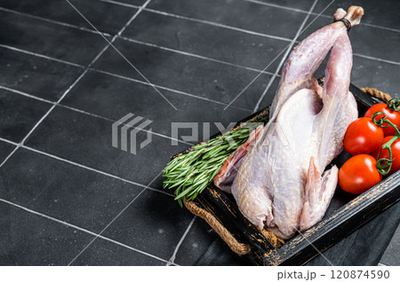 Game bird Raw Guineafowl, guinea fowl ready for cooking. Black background. Top view. Copy space 120874590