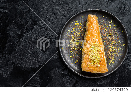 Turkish Havuc Dilim Baklava with pistachio, Carrot Slice Baklava. Black background. Top view. Copy space 120874599