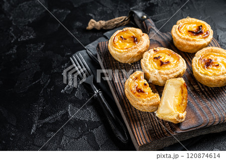 Custard Tarts Pasteis de Belem, Portuguese pastel de Nata. Black background. Top view. Copy space 120874614