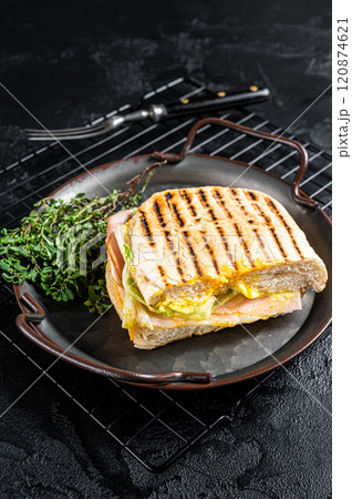Club sandwich panini with Prosciutto ham. Black background. top view 120874621