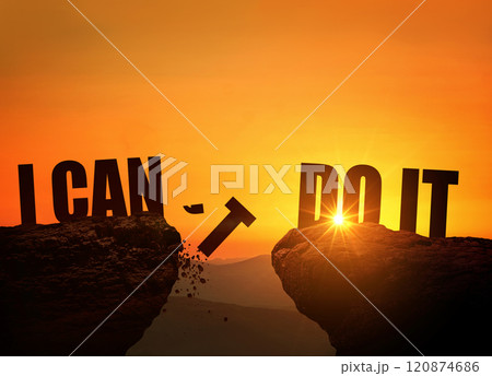 Concept I can't do it and I can do it. I can't the letter t falls into the abyss, creative idea. Two rocks at sunset 120874686