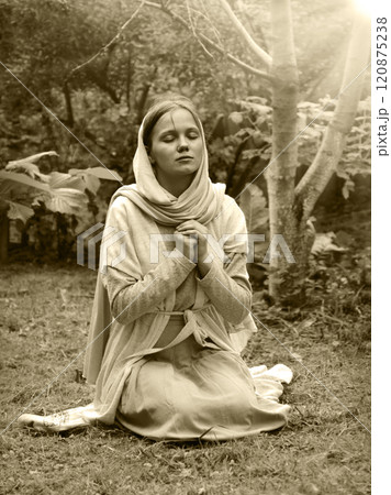 Young girl praying to God Young girl praying to God 120875238