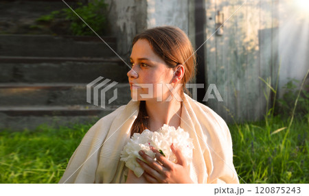 Young girl with white flowers 120875243