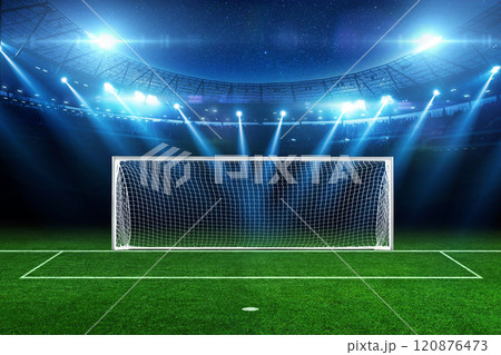 Modern football stadium with a green field with football goals with blue floodlights light at night with stars. Football tournament and football championship. Penalty Modern football stadium with a green field with football goals with blue floodlights light at night with stars. Football tournament and football championship. Penalty 120876473