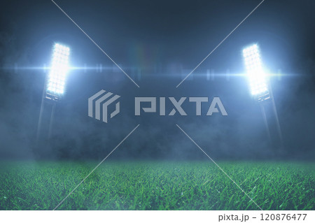 Football stadium with green grass lawn with shining spotlights at night with fog. Free space for design and text. Betting creative 120876477