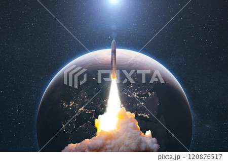 Space rocket lift off into cosmos with smoke and blast on a background of the blue planet earth. Spacecraft flies in space with a starry sky near the planet. Successful start of the mission Space rocket lift off into cosmos with smoke and blast on a background of the blue planet earth. Spacecraft flies in space with a starry sky near the planet. Successful start of the mission 120876517