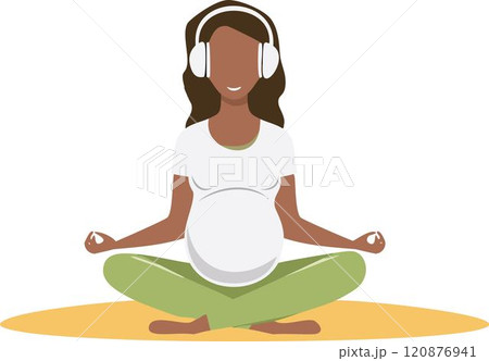 Pregnant woman in white headphones doing yoga 120876941