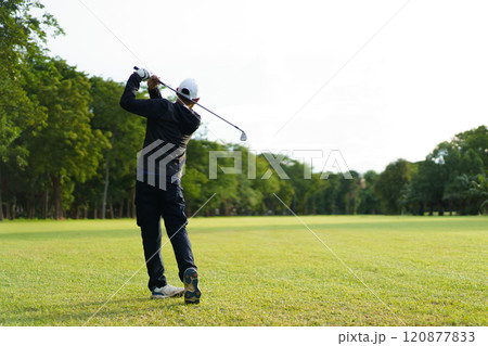 Man is playing golf in morning. Man is playing golf in morning. 120877833