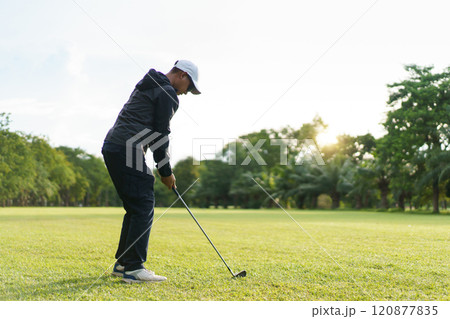 Man is playing golf in morning. Man is playing golf in morning. 120877835