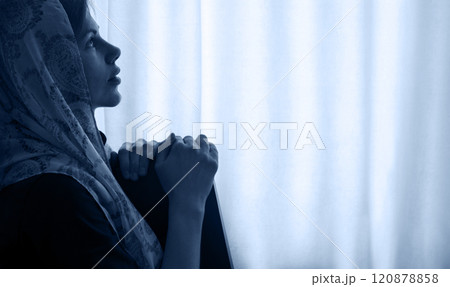 Young girl with bible praying to God 120878858