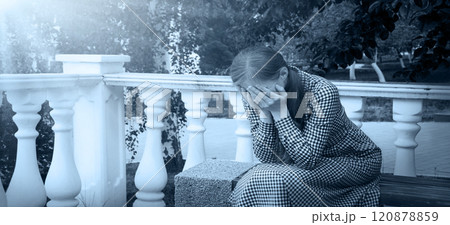 Crying woman in the park 120878859