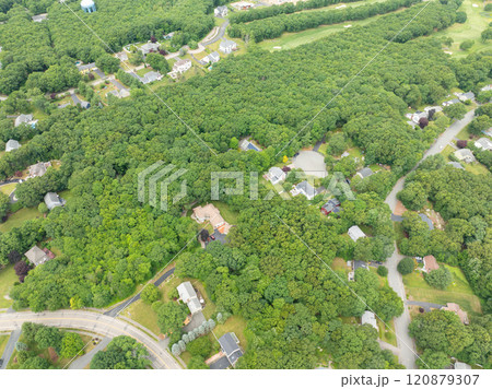 Aerial view of Suburban neighborhood Norfolk County, Massachusetts with green forest, with big villa 120879307