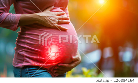 Pregnant woman holding her belly, experiencing pain and discomfort at home. Concept of threat of pregnancy, premature birth 120884164
