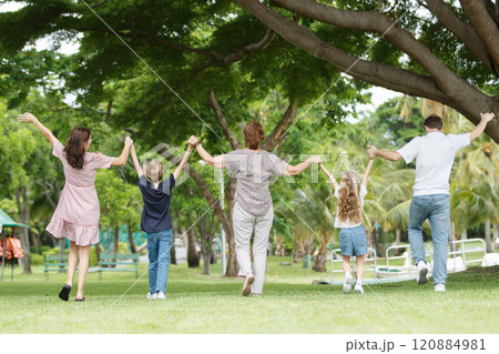 Caucasian family parent and their children picnic at the park in morning. Caucasian family parent and their children picnic at the park in morning. 120884981