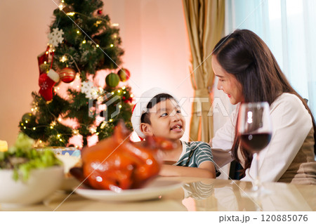 Happy cheerful Asian family celebrating Christmas and New Year dinner party together, a family with mother and son. Asian lovely family celebrate Christmas - New Year festival. Happy cheerful Asian family celebrating Christmas and New Year dinner party together, a family with mother and son. Asian lovely family celebrate Christmas - New Year festival. 120885076