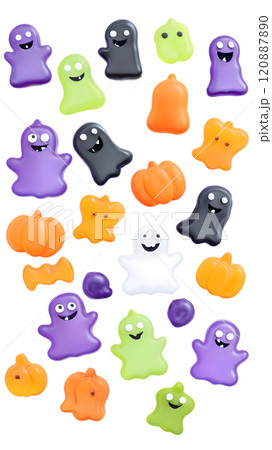 Colorful Halloween-themed candies arranged artfully on a dark background creating a vibrant festive atmosphere. Generative AI 120887890