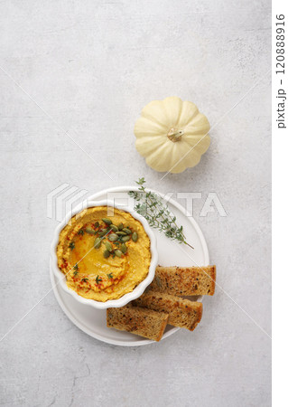 Homemade pumpkin chickpea hummus in a bowl on light background.Top view, copy space Homemade pumpkin chickpea hummus in a bowl on light background.Top view, copy space 120888916