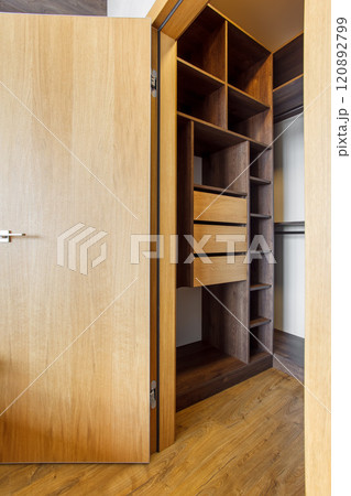 compact built-in wardrobe in the master bedroom 120892799