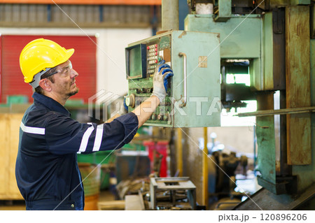 Senior professional electrical or industrial engineer inspecting and repairing a robotic system in the manufacturing factory close up. Robotic technician repairing - fixing a automated machine. Senior professional electrical or industrial engineer inspecting and repairing a robotic system in the manufacturing factory close up. Robotic technician repairing - fixing a automated machine. 120896206
