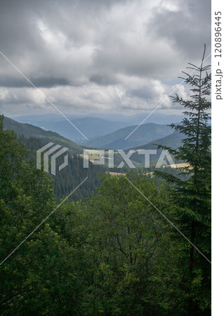 Mountain view under a stormy sky 120896445