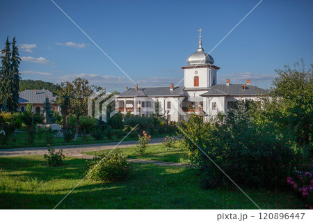 Monastery and courtyard with growing plants 120896447