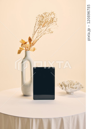 Smartphone positioned vertically in clean minimalist setting, ideal mockup for showcasing apps, promotions, or sleek product presentations. Smartphone positioned vertically in clean minimalist setting, ideal mockup for showcasing apps, promotions, or sleek product presentations. 120896785