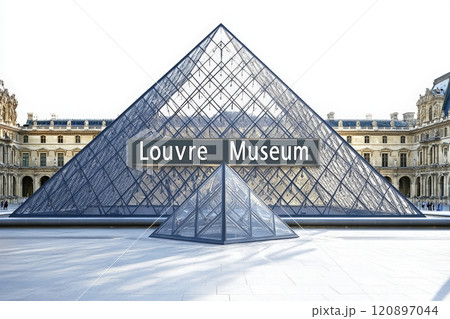 The glass pyramid at the Louvre Museum stands majestically against a clear sky, showcasing its modern architecture. Visitors explore the area around this renowned cultural landmark. 120897044