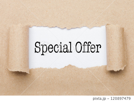 Special Offer text appearing behind brown paper Special Offer text appearing behind brown paper 120897479