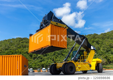Reach stacker cargo forklift container box import export logistic transportation industrial, Reach stacker pick up container, Reach stacker container loader crane lifting maritime cargo container. Reach stacker cargo forklift container box import export logistic transportation industrial, Reach stacker pick up container, Reach stacker container loader crane lifting maritime cargo container. 120898686