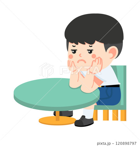 boy sitting at a table with his hand on his chin 120898797