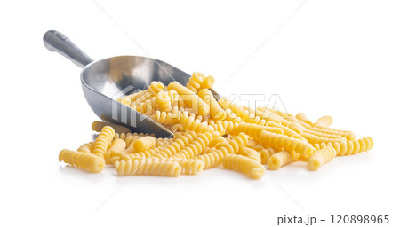 Uncooked italian pasta. Fusilli pasta in scoop isolated on white background. 120898965
