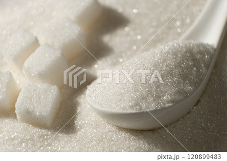 White refined beet sugar in the form of crystals and cubes. White refined beet sugar in the form of crystals and cubes. 120899483