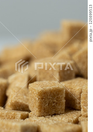 Macro cubes of brown cane unrefined demerara sugar. Macro cubes of brown cane unrefined demerara sugar. 120899513