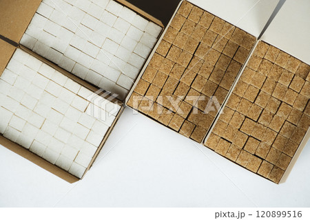 Cubes of demerara cane sugar and white beet sugar top view Cubes of demerara cane sugar and white beet sugar top view 120899516