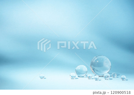 Blue background with transparent glass balls. Blue background with transparent glass balls. 120900518