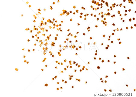 Festive golden stars of confetti on a white background. Festive golden stars of confetti on a white background. 120900521
