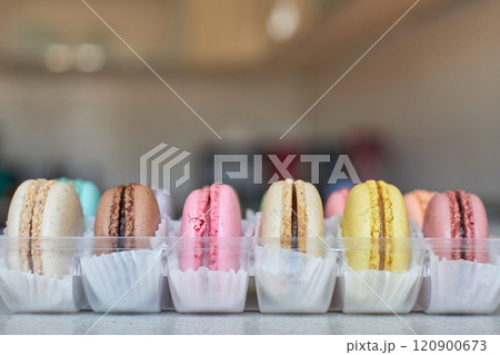 Colorful cakes French Macarons with white paperpan in plastic transparent box Colorful cakes French Macarons with white paperpan in plastic transparent box 120900673