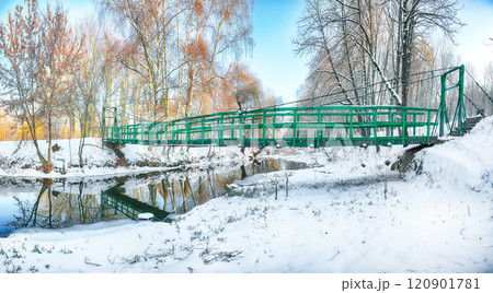 Breathtaking landscape in city park with snowy trees and beautiful reflection in frozen river. Breathtaking landscape in city park with snowy trees and beautiful reflection in frozen river. 120901781