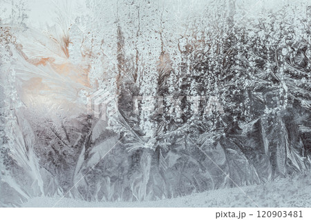 Frost natural pattern on a frozen window. Frosty drawing winter background. Frost natural pattern on a frozen window. Frosty drawing winter background. 120903481