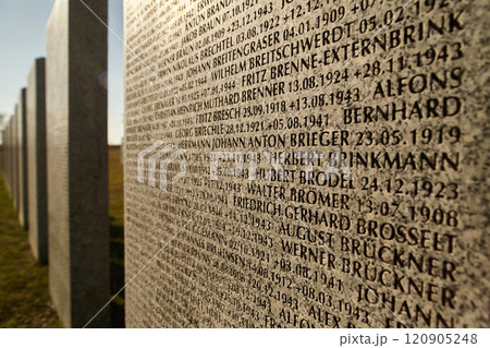 Large stone with engraved inscriptions against the backdrop of the sunset. Concept of perpetuation, memory Large stone with engraved inscriptions against the backdrop of the sunset. Concept of perpetuation, memory 120905248