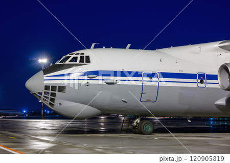 Close-up big cargo aircraft at the airport apron in the night 120905819