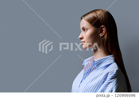 Profile portrait of young teenage girl, gray studio copy space background Profile portrait of young teenage girl, gray studio copy space background 120906096