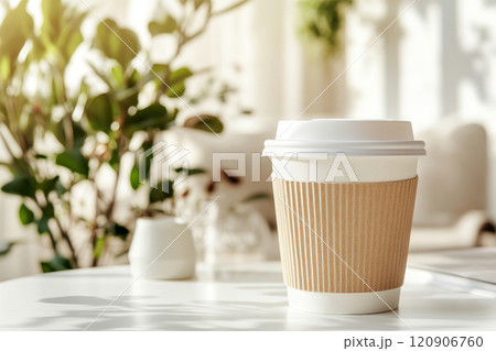 Takeaway coffee cup with a cardboard sleeve in a bright modern cafe Takeaway coffee cup with a cardboard sleeve in a bright modern cafe 120906760