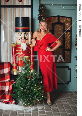 elegant woman in red dress with festive makeup elegant woman in red dress with festive makeup 120907668