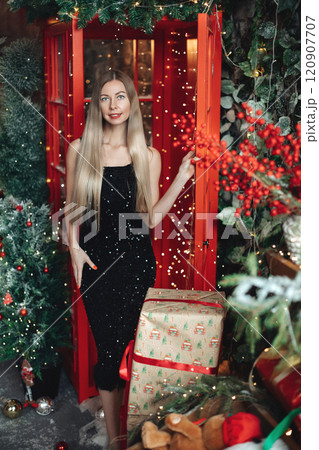 Beautiful elegant woman in black dress with 120907707