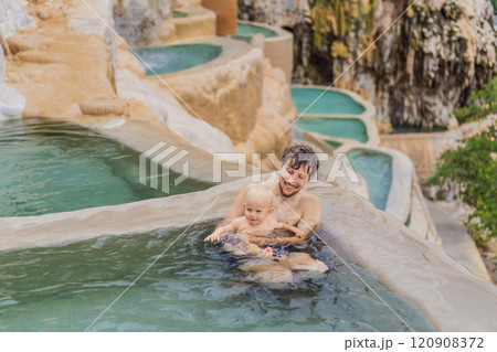 Father with his toddler son bathing in the hot springs of Grutas Tolantongo, Mexico. Family adventure, relaxation, and natural wellness concept Father with his toddler son bathing in the hot springs of Grutas Tolantongo, Mexico. Family adventure, relaxation, and natural wellness concept 120908372