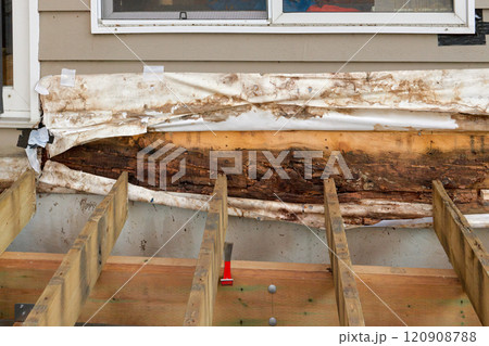 Removed Deck Ledger Board Reveals Dry Rotten Rim Joist Board with Extensive Damage on House 120908788