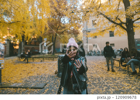 Experiencing the delightful Autumn Vibes in a Park filled with Colorful Leaves all around Experiencing the delightful Autumn Vibes in a Park filled with Colorful Leaves all around 120909678